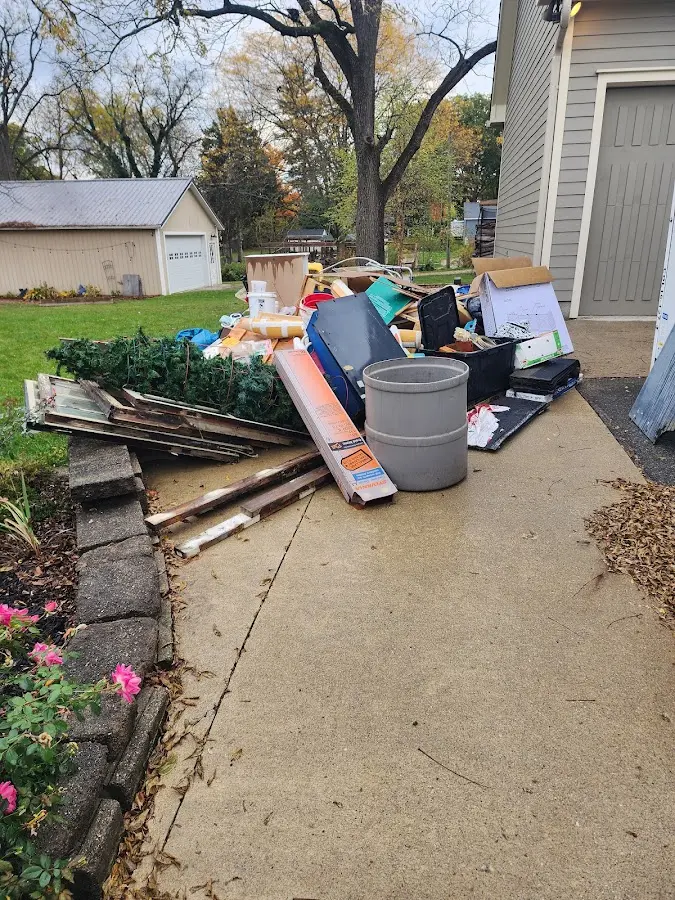 Dumpster being loaded with debris for Commercial Dumpster Rental in Lower Providence